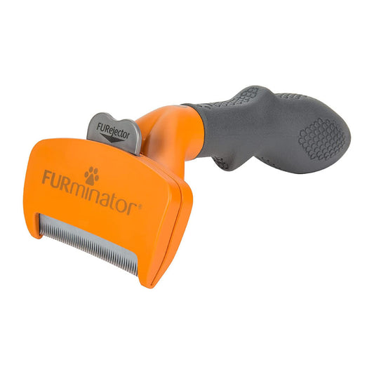 Orange FURminator dog deShedding tool with a stainless steel edge, gray handle and FURejector button