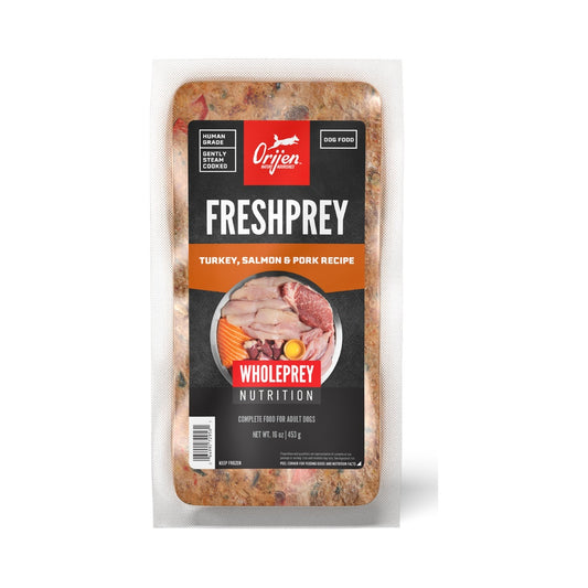 ORIJEN FreshPrey Turkey, Salmon & Pork Recipe 16 oz frozen dog food pouch, showing the orange front label and food through the clear packaging.