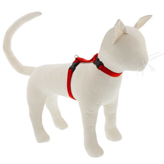 White cat mannequin wearing a red Lupine Pet H-style harness, showing the neck and girth straps.