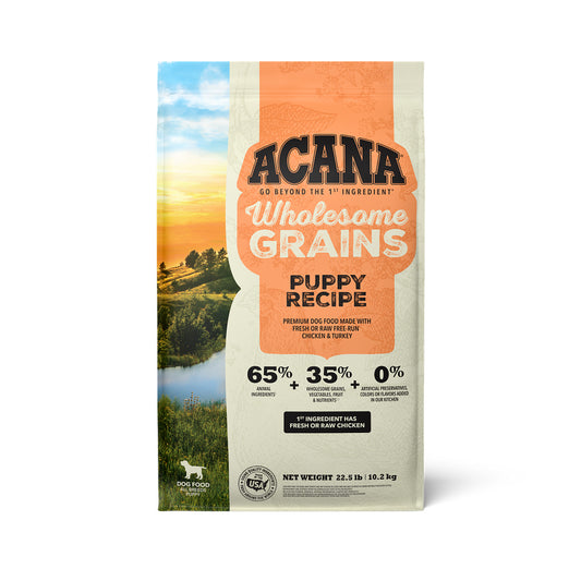 Front of ACANA Wholesome Grains Puppy Recipe dry dog food bag with an orange label.