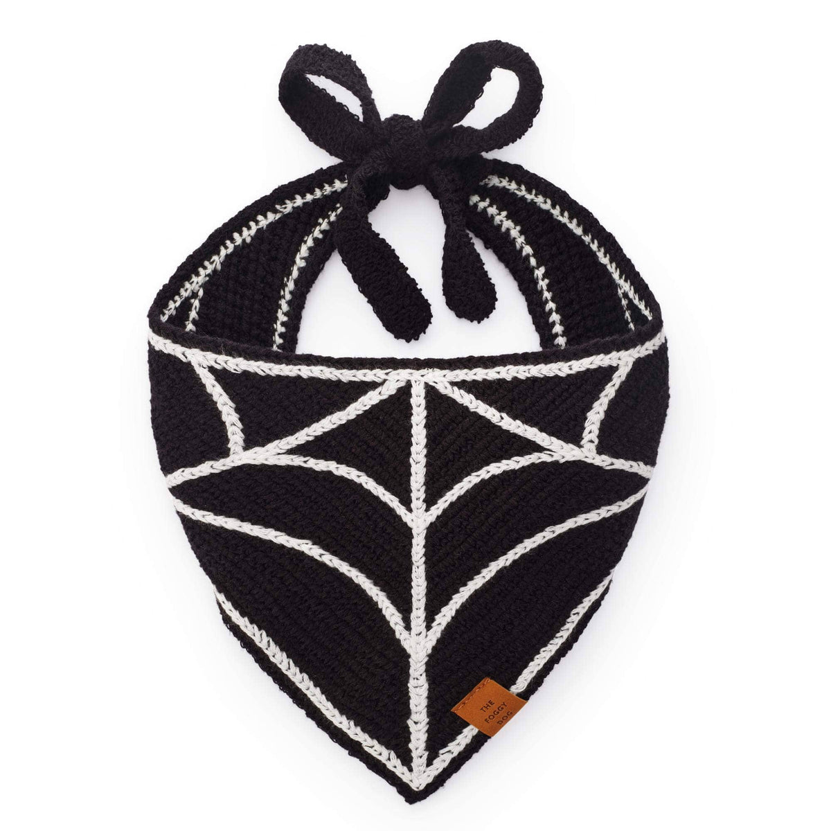 The Foggy Dog Spiderweb Crochet dog bandana in black with a white stitched spiderweb pattern and tie straps