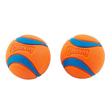 Two orange Chuckit! Ultra rubber dog balls with blue curved bands, textured surfaces, and raised Chuckit! logos.