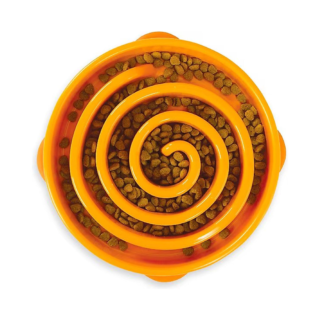 Orange Outward Hound Fun Feeder Slo Bowl filled with kibble around a spiral slow-feeding maze, shown from above.