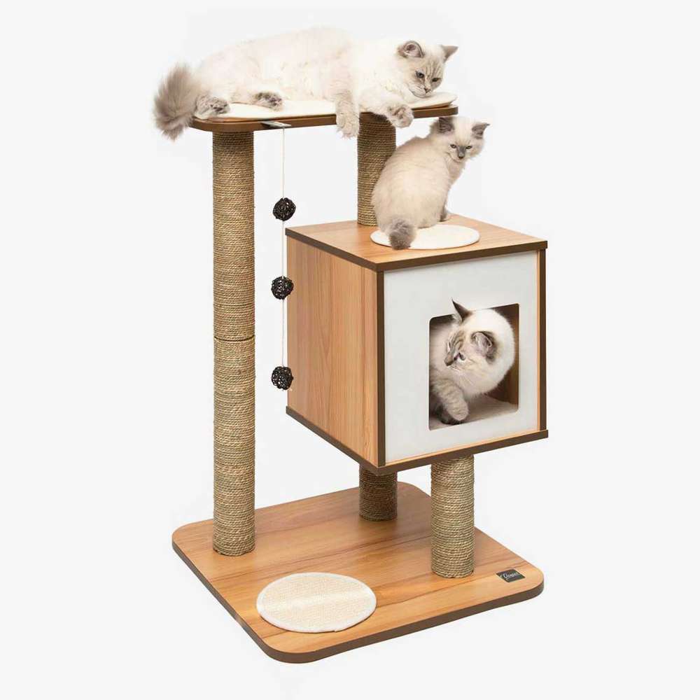 Three cats resting on a Catit Vesper Base walnut-look cat tree with a top perch, cube hideaway, rope-wrapped scratching posts, and hanging balls.