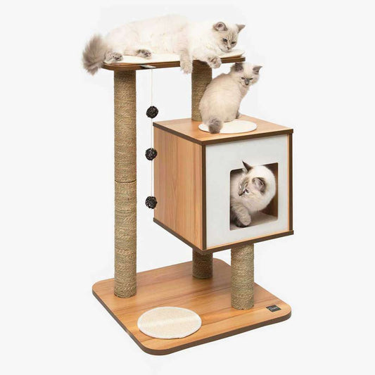 Three cats resting on a Catit Vesper Base walnut-look cat tree with a top perch, cube hideaway, rope-wrapped scratching posts, and hanging balls.