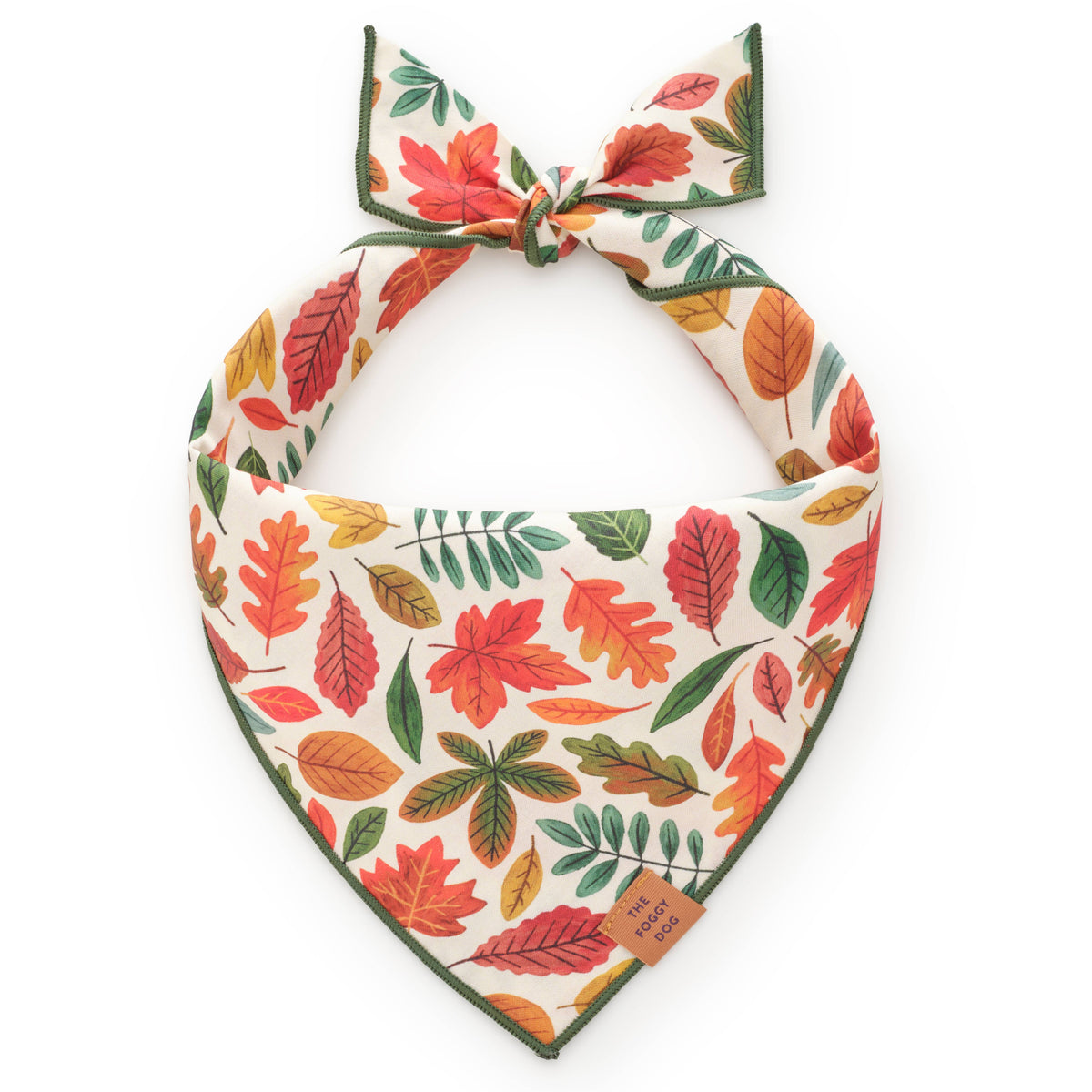 The Foggy Dog Falling Leaves dog bandana with colorful autumn leaves on cream fabric and green edging