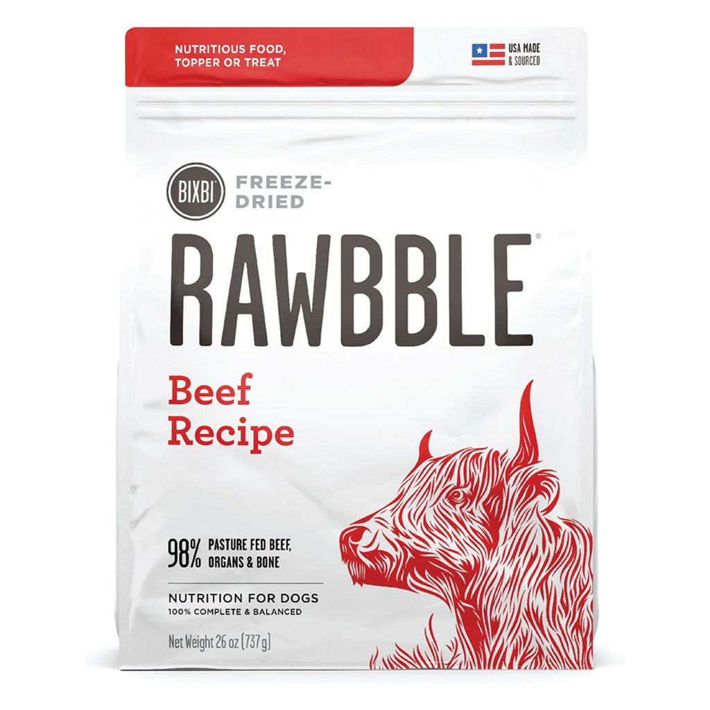 Front of a 26 oz bag of BIXBI RAWBBLE Beef Recipe freeze-dried dog food, with red lettering and a cattle illustration.