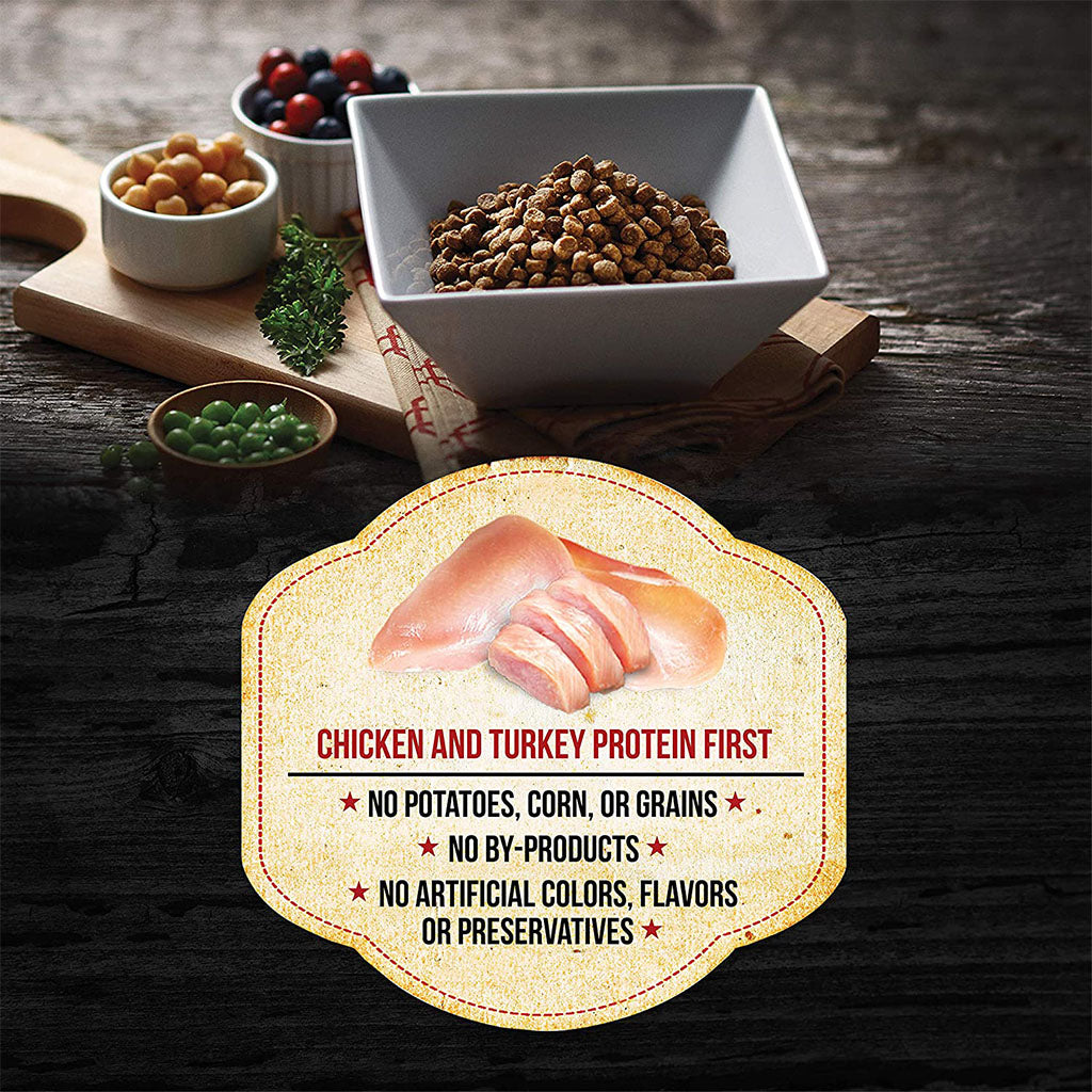 Square bowl of Fussie Cat Market Fresh kibble beside peas, chickpeas and berries, with a chicken and turkey protein first graphic