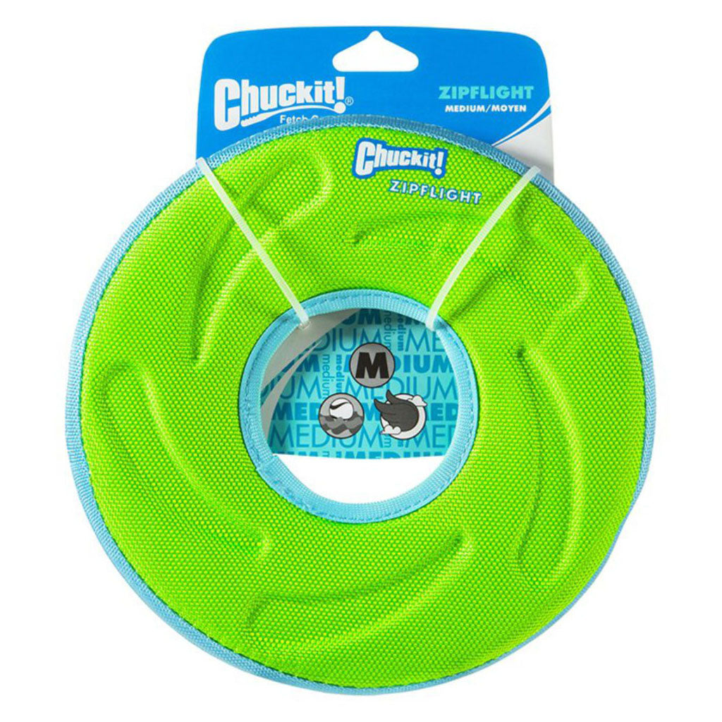 Green Chuckit! Zipflight medium flying disc with a blue rim and center opening on retail packaging marked Medium.