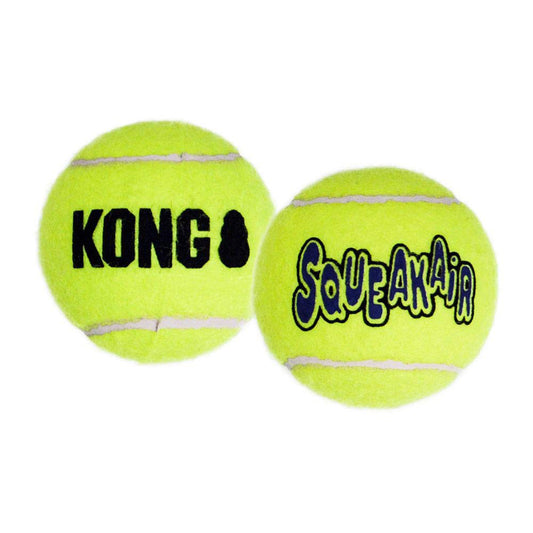 Two yellow KONG SqueakAir tennis balls with black logos on a white background.
