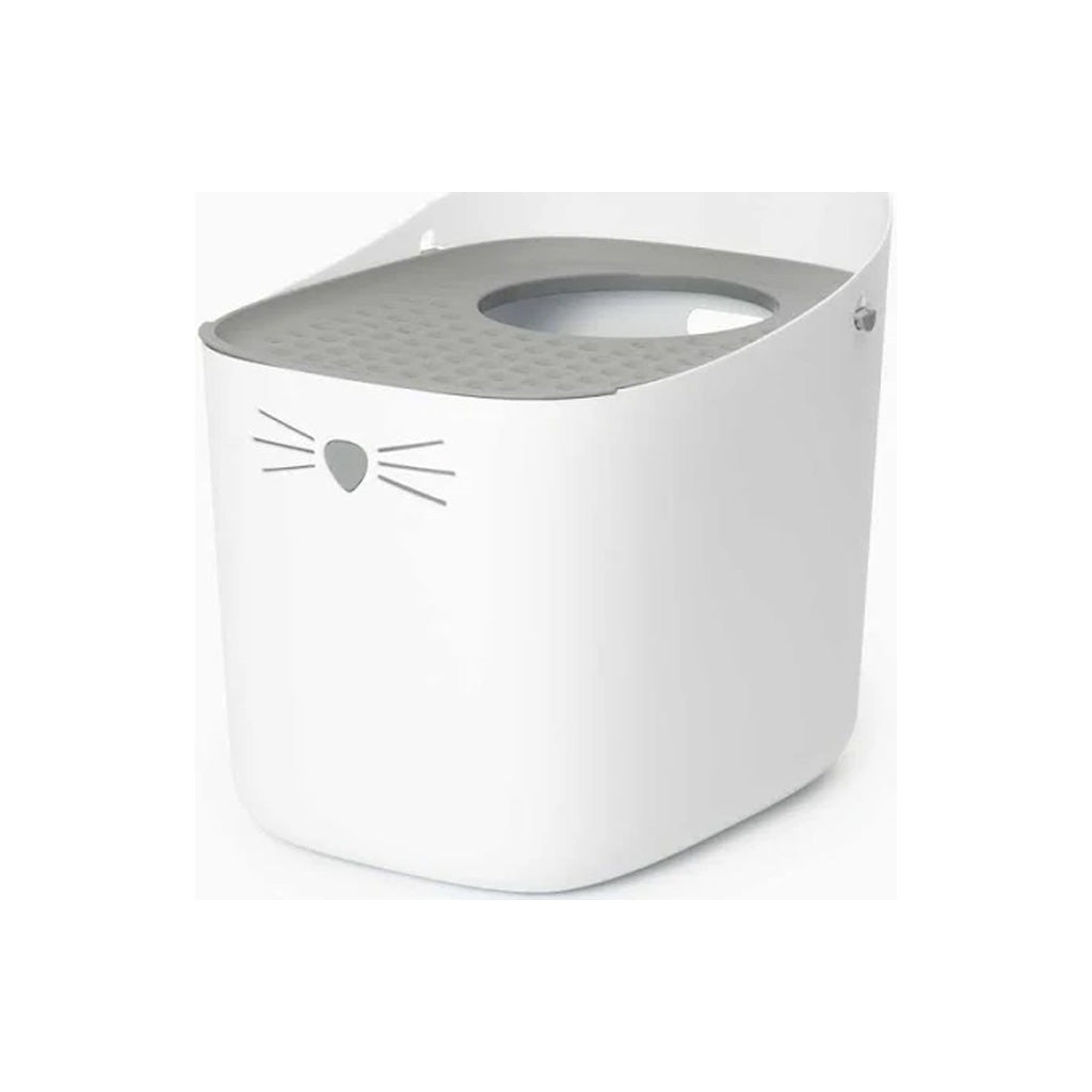 White Catit PIXI top-entry litter box with a gray perforated lid, oval entry opening, and cat nose and whiskers on the front.