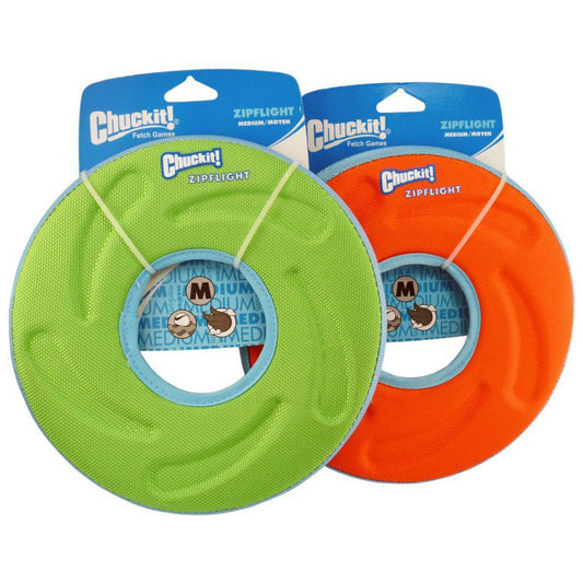 Green and orange Chuckit! Zipflight medium flying discs with blue rims and center openings on retail packaging.