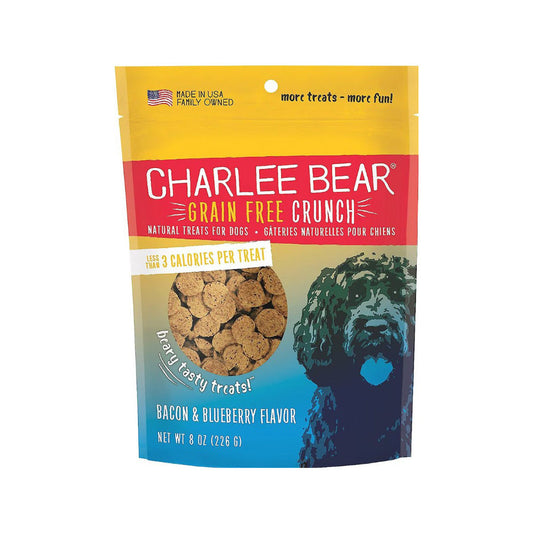 Front of an 8 oz Charlee Bear Grain Free Crunch Bacon & Blueberry Flavor dog treat bag with a yellow top, red label, blue dog illustration, and visible round treats.