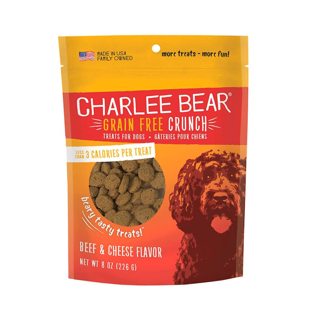 Front of an 8 oz Charlee Bear Grain Free Crunch Beef & Cheese Flavor dog treat bag with a yellow top, red label, orange dog illustration, and visible round treats.