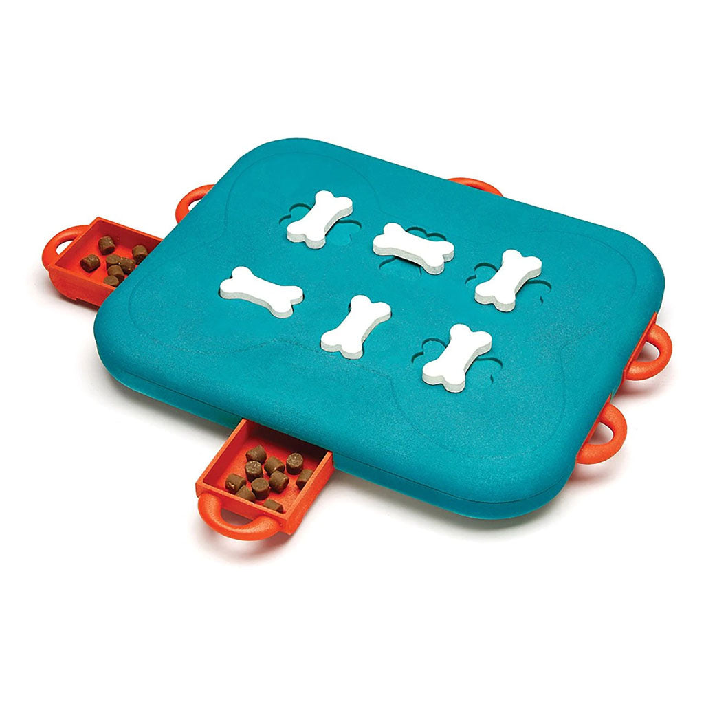 Turquoise Dog Casino puzzle with six white bone-shaped locks and red pull-out drawers containing treats.