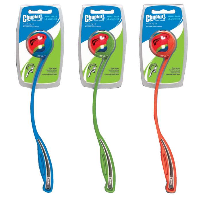 Three packaged Chuckit! Mini Sport Ball Launchers in blue, green, and red, with ergonomic grips and included mini tennis balls.