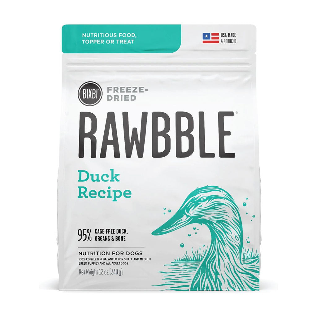 Front of a 12 oz bag of BIXBI RAWBBLE Duck Recipe freeze-dried dog food, with teal lettering and a duck illustration.
