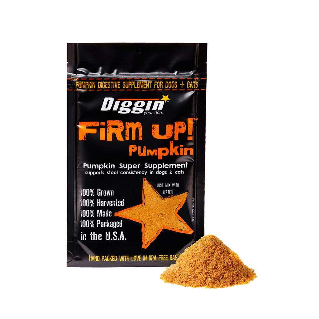 Diggin' Your Dog Firm Up! Pumpkin supplement for dogs and cats in a black and orange pouch beside a mound of pumpkin powder.