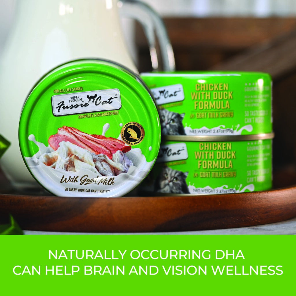 Fussie Cat Chicken with Duck in Goat Milk Gravy cans with text about naturally occurring DHA supporting brain and vision wellness