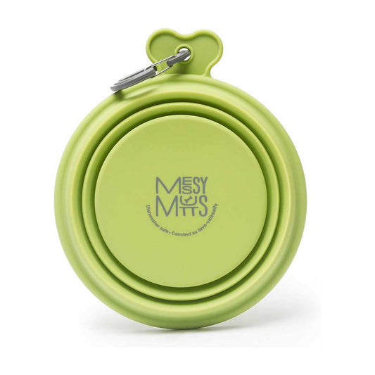Green Messy Mutts silicone travel bowl folded flat, showing its logo and attached gray carabiner.