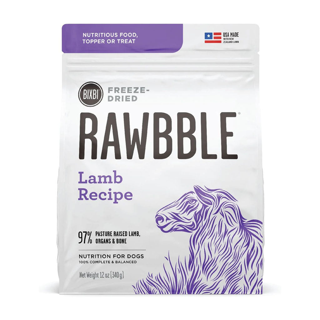 Front of a 12 oz bag of BIXBI RAWBBLE Lamb Recipe freeze-dried dog food, with purple lettering and a sheep illustration.