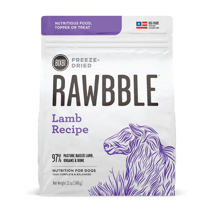 Front of a 12 oz bag of BIXBI RAWBBLE Lamb Recipe freeze-dried dog food, with purple lettering and a sheep illustration.