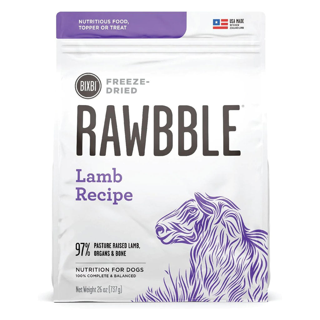 Front of a 26 oz bag of BIXBI RAWBBLE Lamb Recipe freeze-dried dog food, with purple lettering and a sheep illustration.