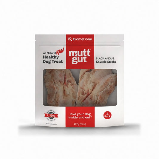MuttGut Black Angus Knuckle Steaks in a white and red four-count pouch with raw beef bones visible through the window.