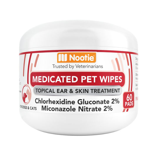 Nootie Medicated Pet Wipes for dogs and cats, white 60-pad jar labeled chlorhexidine gluconate 2% and miconazole nitrate 2%.