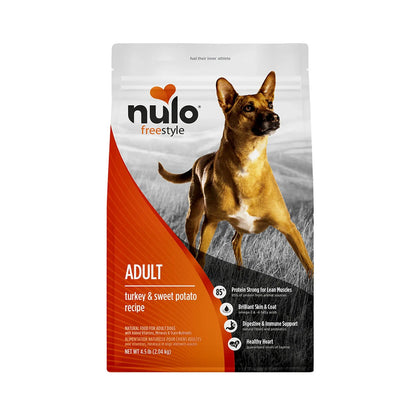 Front of Nulo FreeStyle Turkey & Sweet Potato grain-free adult dry dog food bag, with orange packaging and a brown dog, on white.