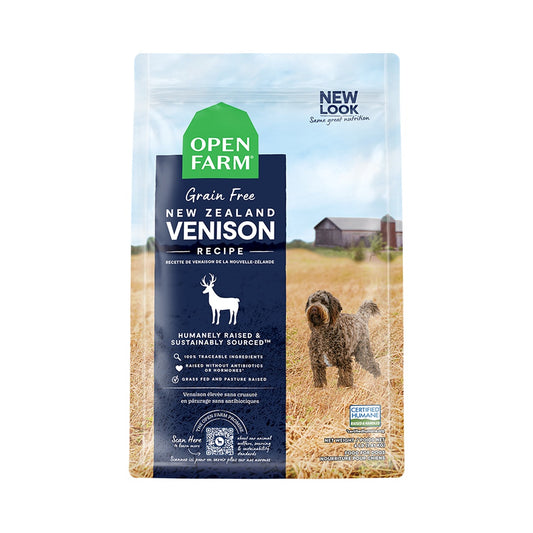 Front of Open Farm Grain Free New Zealand Venison Recipe dry dog food bag with navy label and a dog pictured in a field