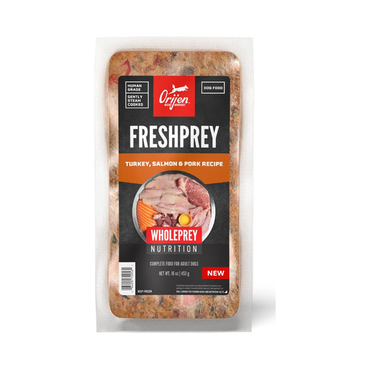 Front of ORIJEN FreshPrey Turkey, Salmon & Pork Recipe 16 oz frozen dog food bar in a clear pouch with an orange recipe label.