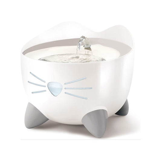 White Catit PIXI cat drinking fountain with flowing water, cat ears, a nose-and-whiskers water level window, and gray feet.