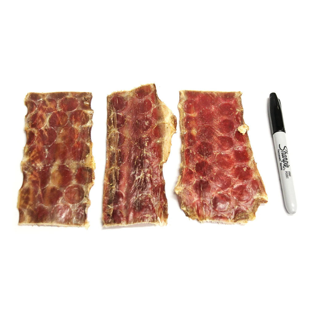 Beef Gullet Strips 6oz compared in size to a marker.