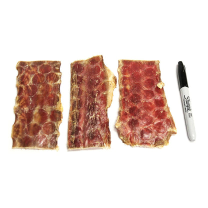 Beef Gullet Strips 6oz compared in size to a marker.