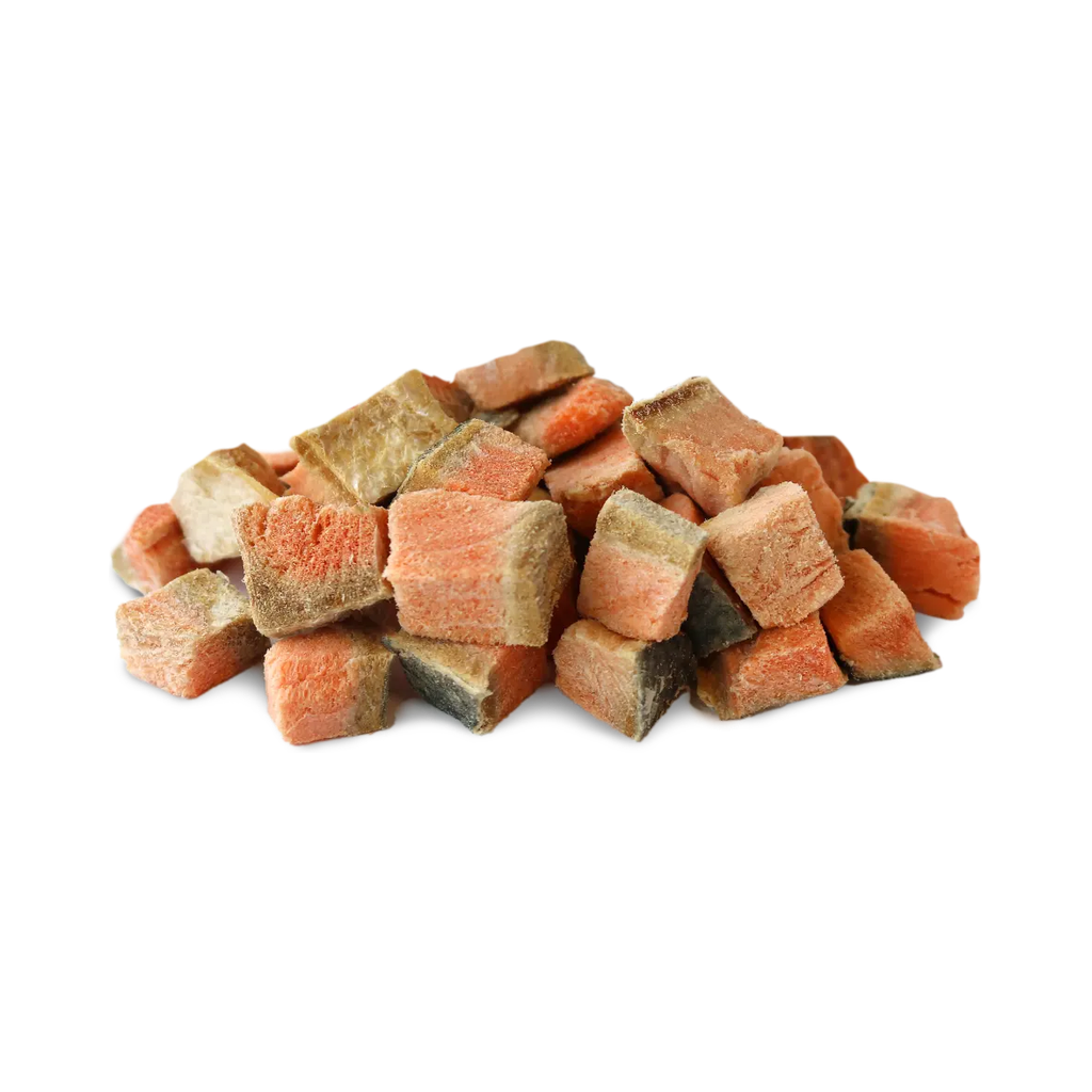 Pile of Vital Essentials freeze-dried diced salmon dog treat pieces on a white background