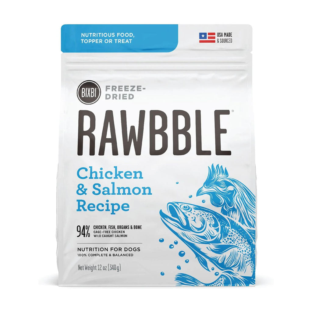 Front of a 12 oz bag of BIXBI RAWBBLE Chicken & Salmon Recipe freeze-dried dog food, with blue lettering and chicken and salmon illustrations.