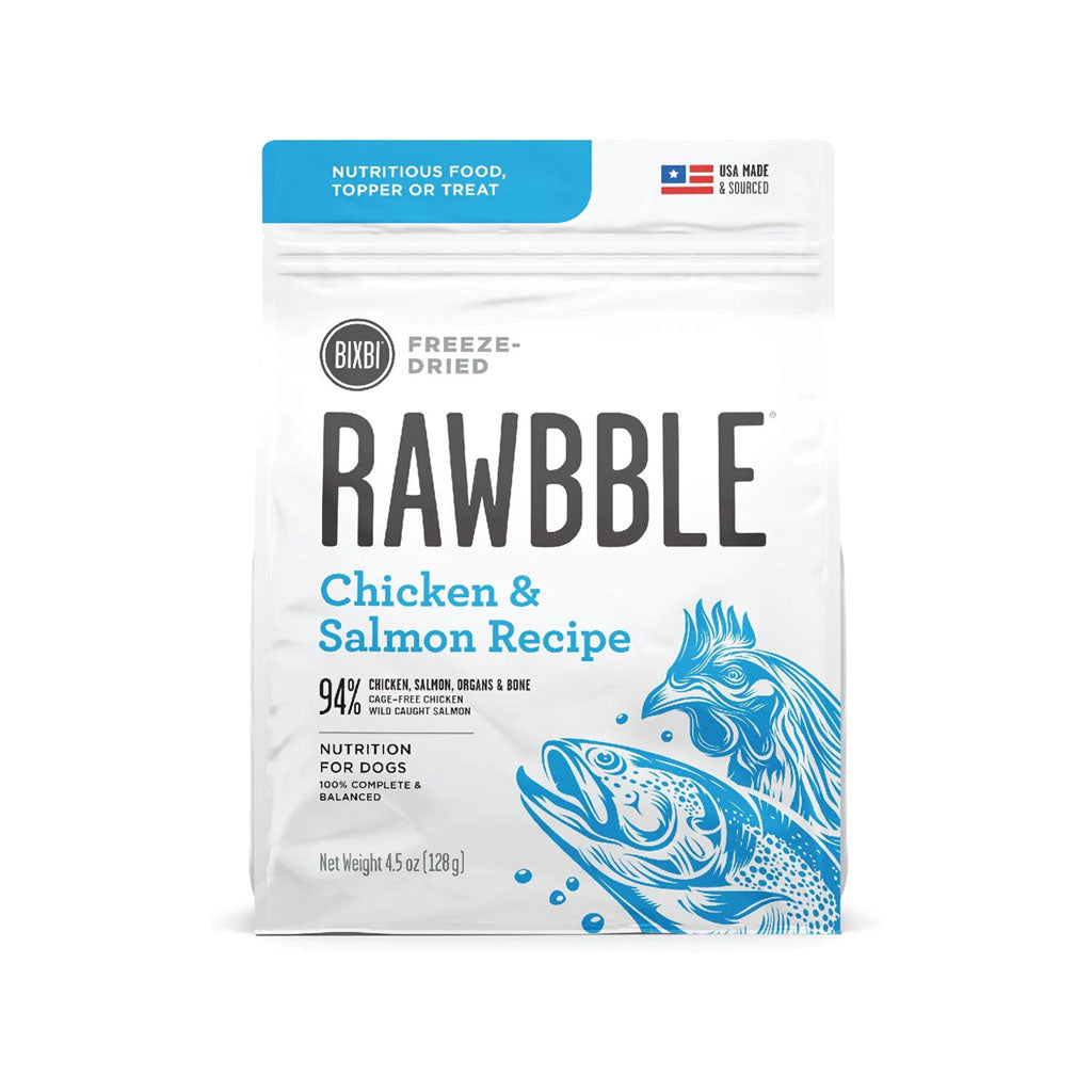 Front of a 4.5 oz bag of BIXBI RAWBBLE Chicken & Salmon Recipe freeze-dried dog food, with blue lettering and chicken and salmon illustrations.