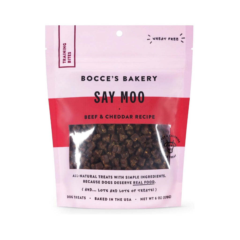 Front of a 6 oz pink pouch of Bocce’s Bakery Say Moo Beef & Cheddar training bites for dogs, with small treats visible through the window.