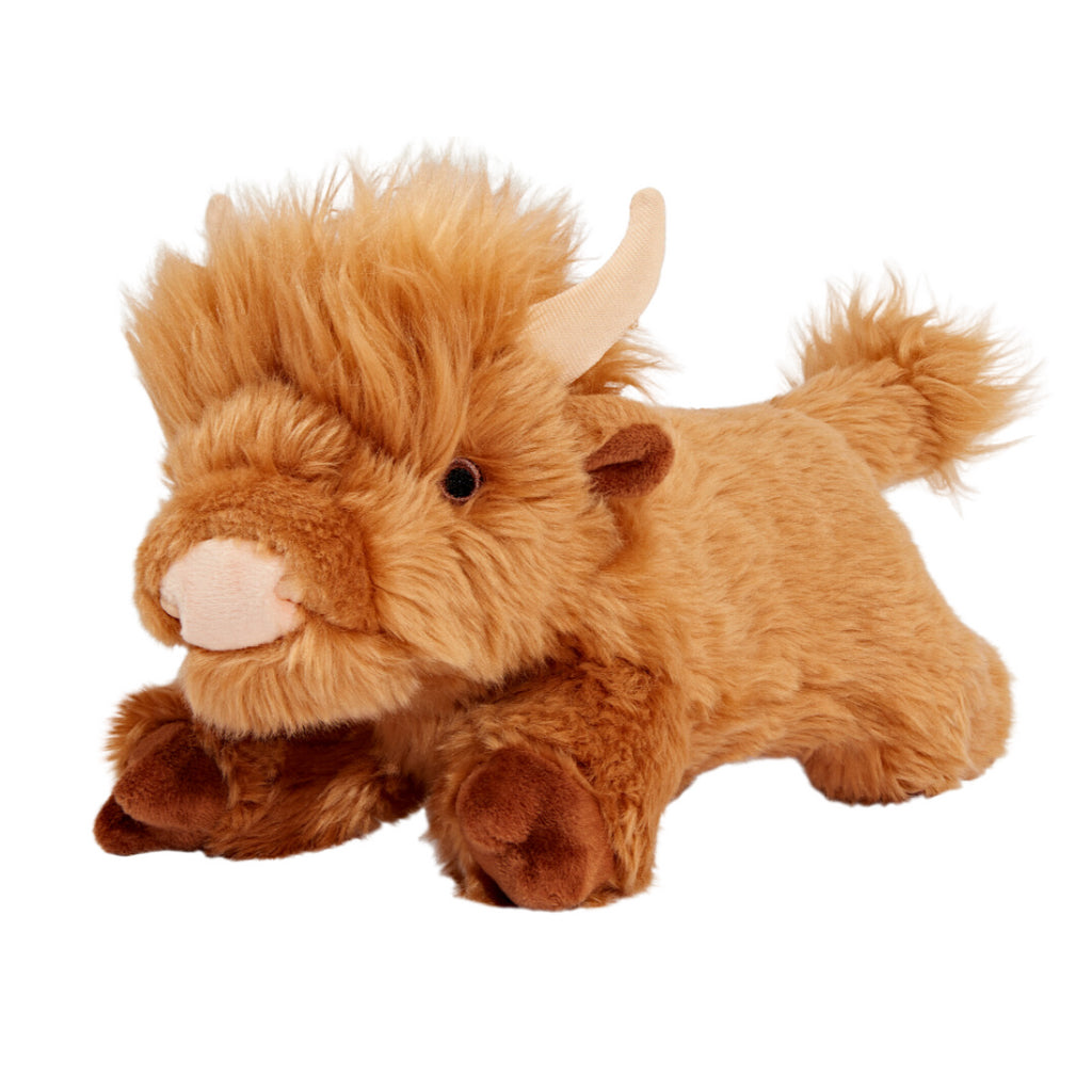 Fluff & Tuff Shaggy Cow plush dog toy with golden-brown fur, a shaggy forelock, cream horns and brown hooves.