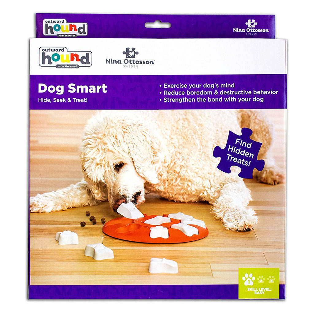 Nina Ottosson by Outward Hound Dog Smart packaging showing an orange treat puzzle with removable white bone covers and Level 1 easy difficulty.