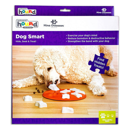 Nina Ottosson by Outward Hound Dog Smart packaging showing an orange treat puzzle with removable white bone covers and Level 1 easy difficulty.