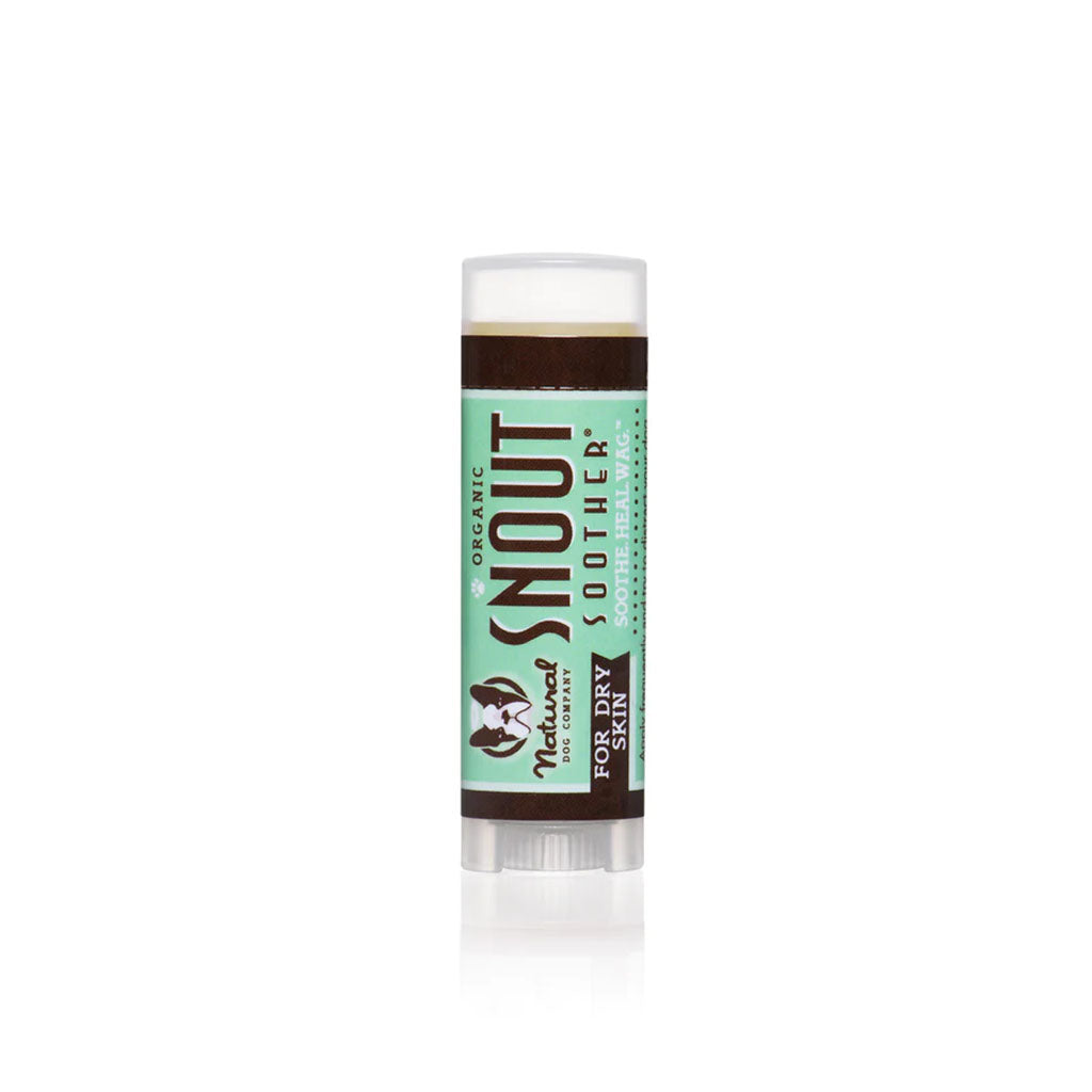 Natural Dog Company Snout Soother travel balm stick with a green label and clear cap.