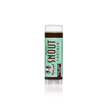 Natural Dog Company Snout Soother travel balm stick with a green label and clear cap.
