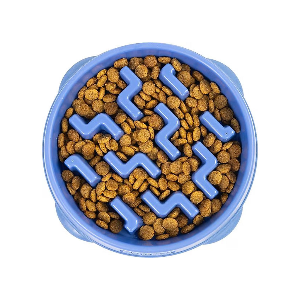 Top view of a blue Outward Hound Fun Feeder Slo Bowl with raised zigzag dividers and kibble between them.