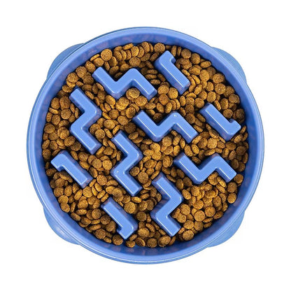 Blue Outward Hound Fun Feeder Slo Bowl filled with kibble around raised zigzag obstacles, shown from above.