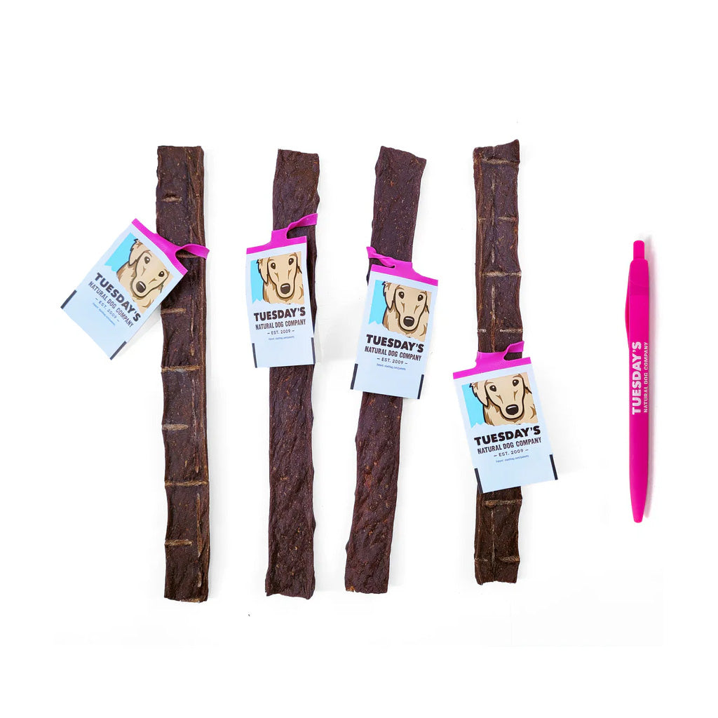 4 ostrich jerky next to a pen. about double the length of a pen.
