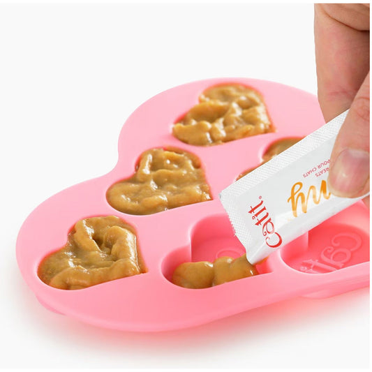 Treat mixed into Heart Shaped Silicone Ice Tray 