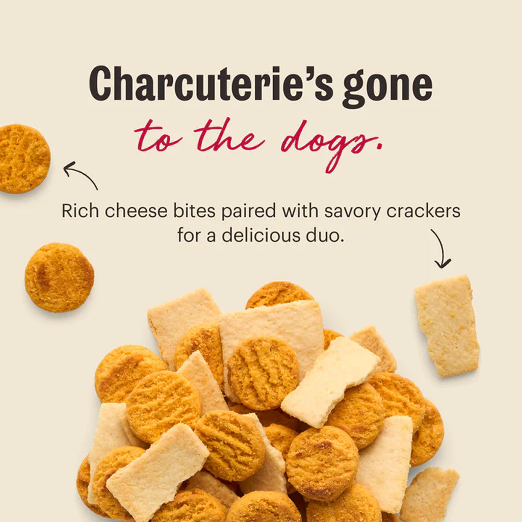 Charcuterie's gone to the dogs. Rich cheese bites paired with savory crackers for a delicious duo.