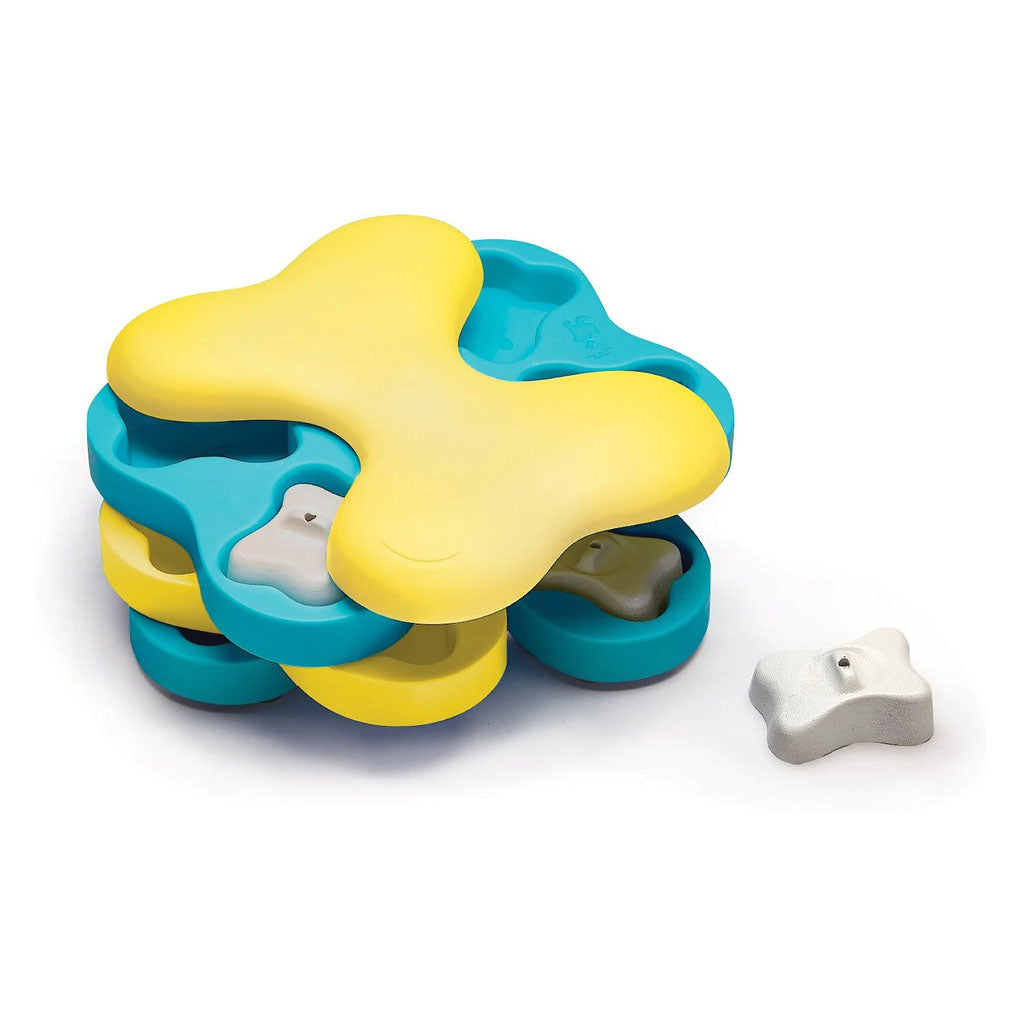 Dog Tornado puzzle with stacked blue and yellow rotating bone-shaped trays and removable white bone covers over treat compartments.